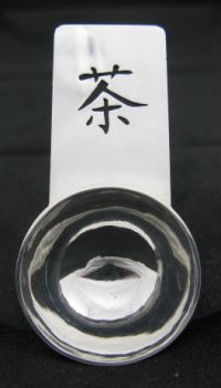 Silver caddy spoon with Chinese character for tea